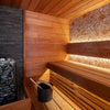 Wooden sauna with stone stove and mosaic wall