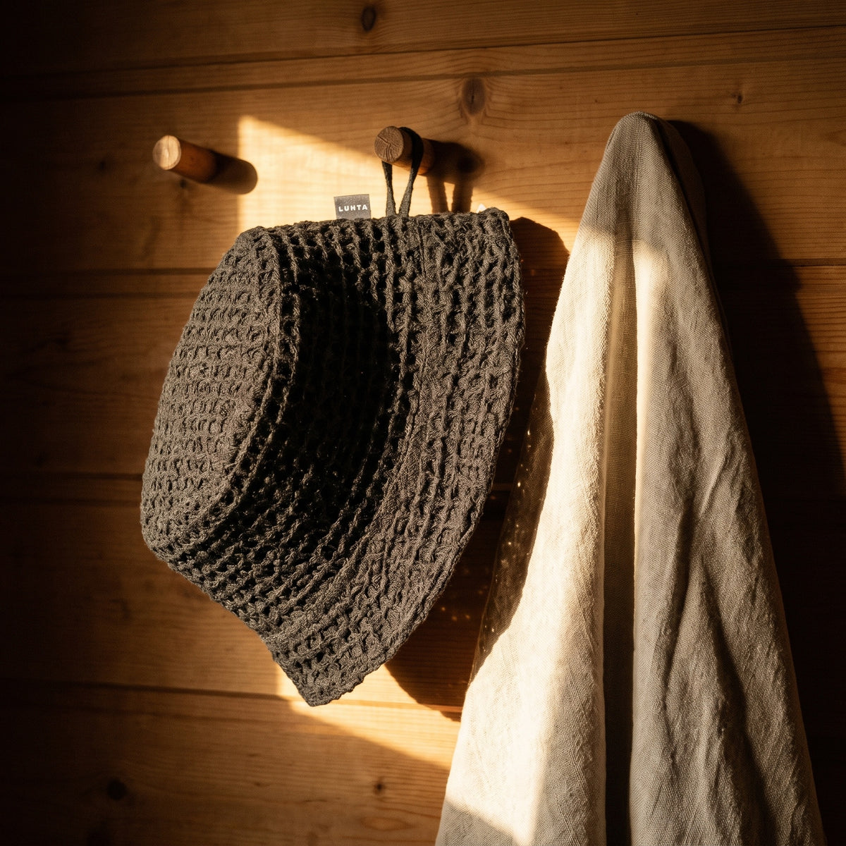 Luhta Pellava Sauna Bucket Hat - hanging on a sauna peg