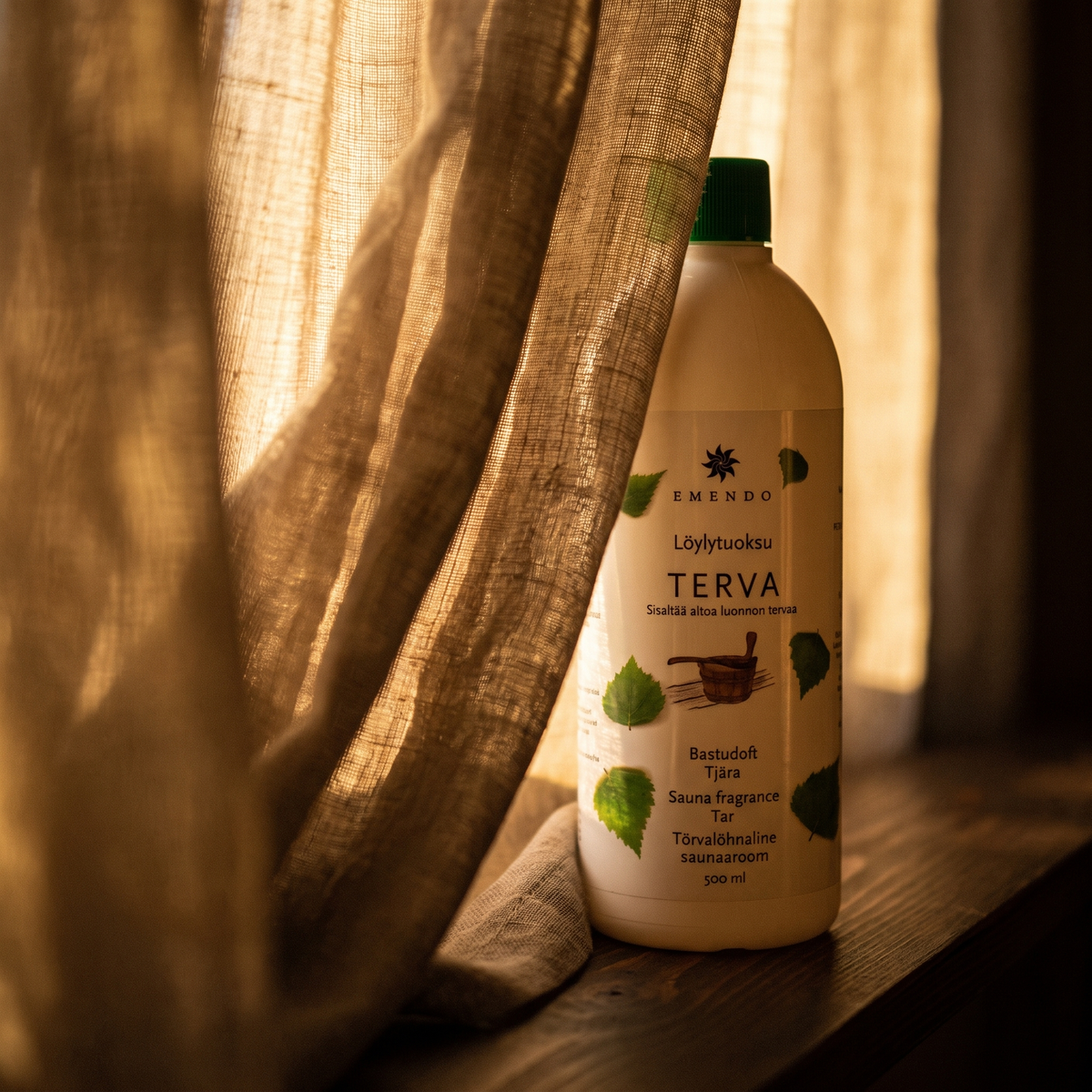 Emendo Tar Sauna Scent (500ml) - lifestyle behind linen curtain