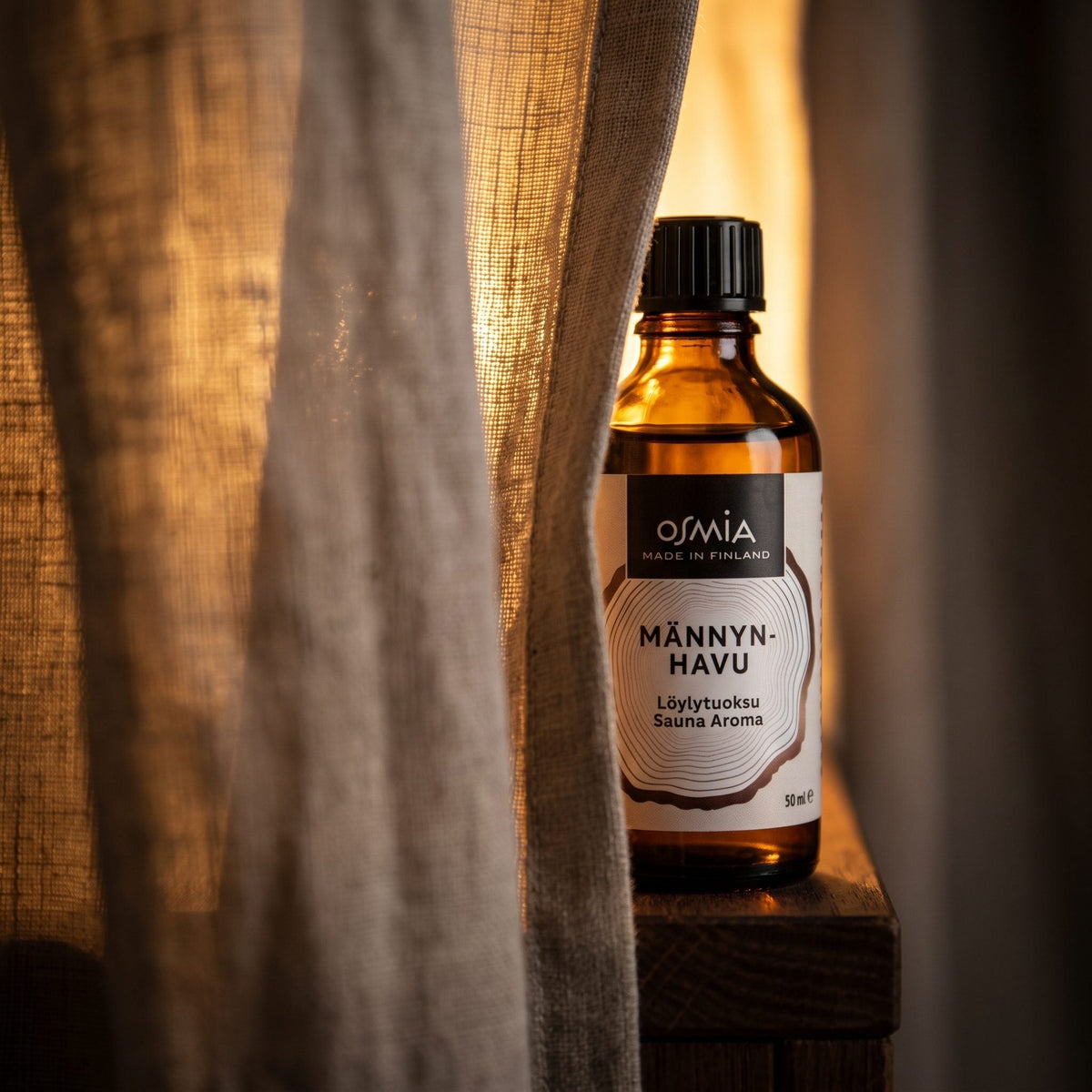 Pine Forest Sauna Aroma by Osmia (50ml) - lifestyle behind linen curtain