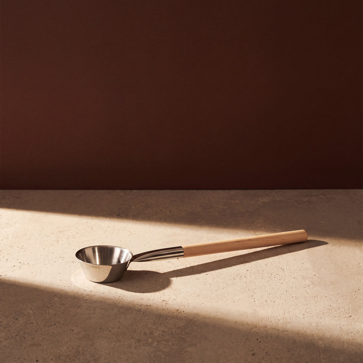 Rento x Harri Koskinen Glossy Steel Sauna Ladle - lifestyle in sunlight