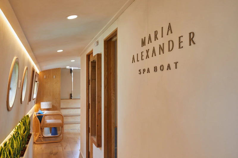 Hallway with 'Maria Alexander Spa Boat' sign on a wall