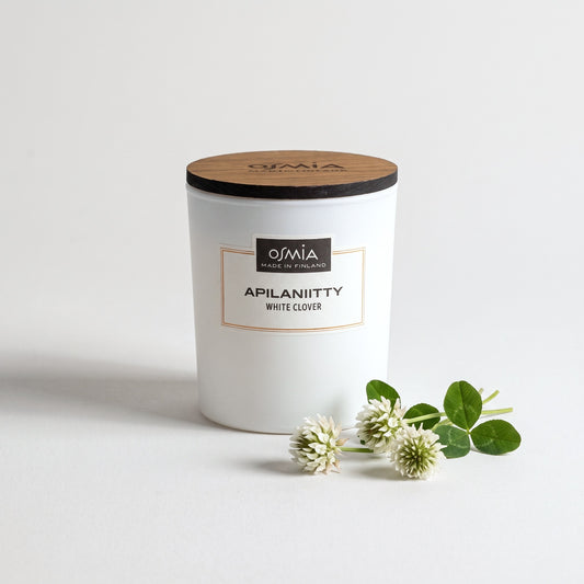 White Clover Scented Candle by Osmia with white clover flowers