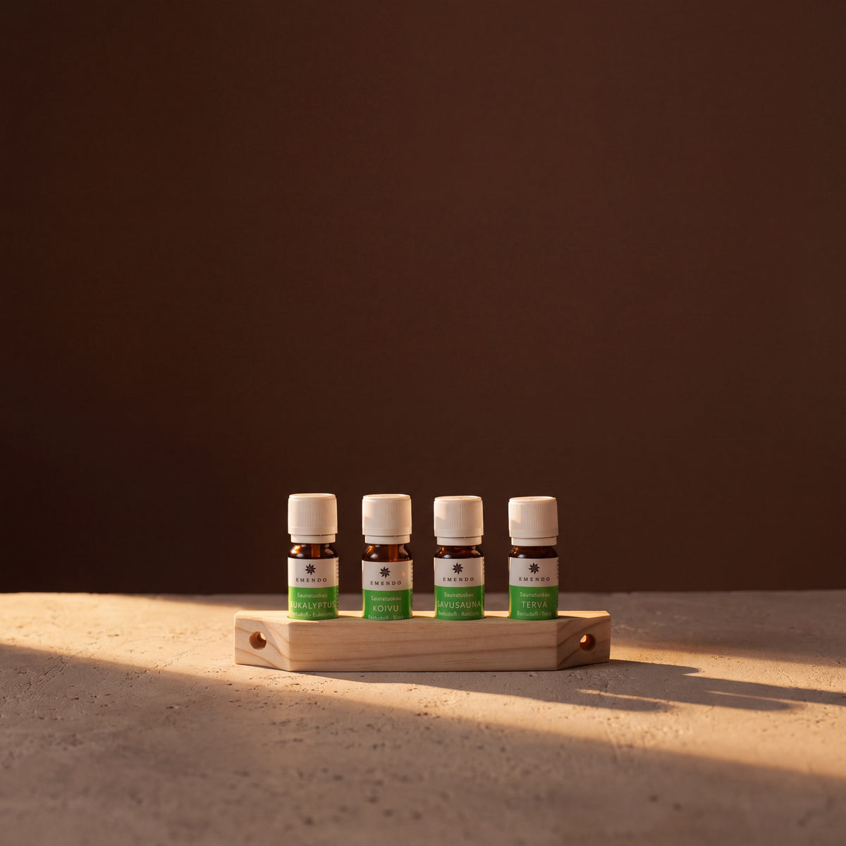 Emendo Sauna Scent Wall Rack (4 x 10ml) - lifestyle in sunlight