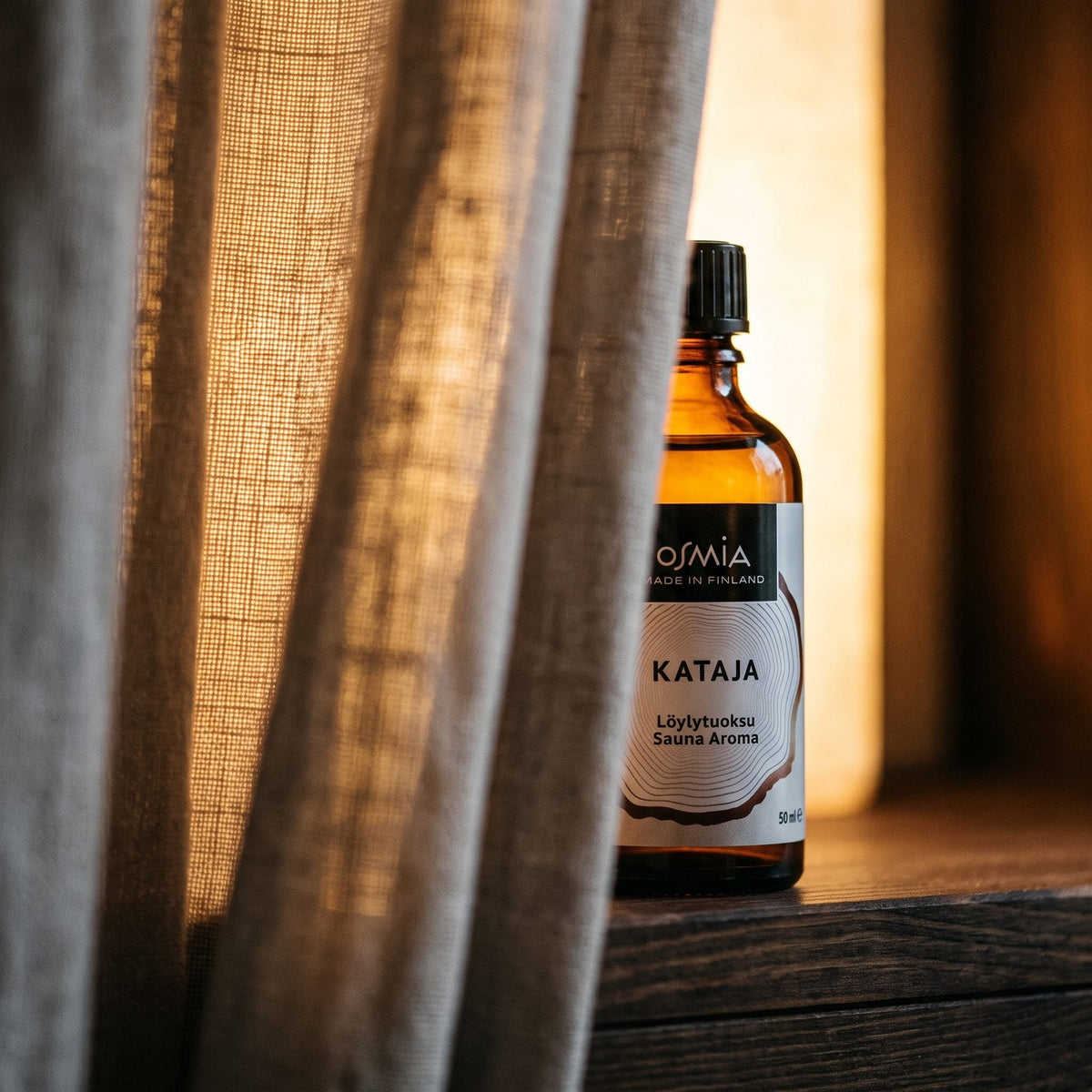 Juniper Berry Sauna Aroma by Osmia (50ml) - lifestyle behind linen curtain
