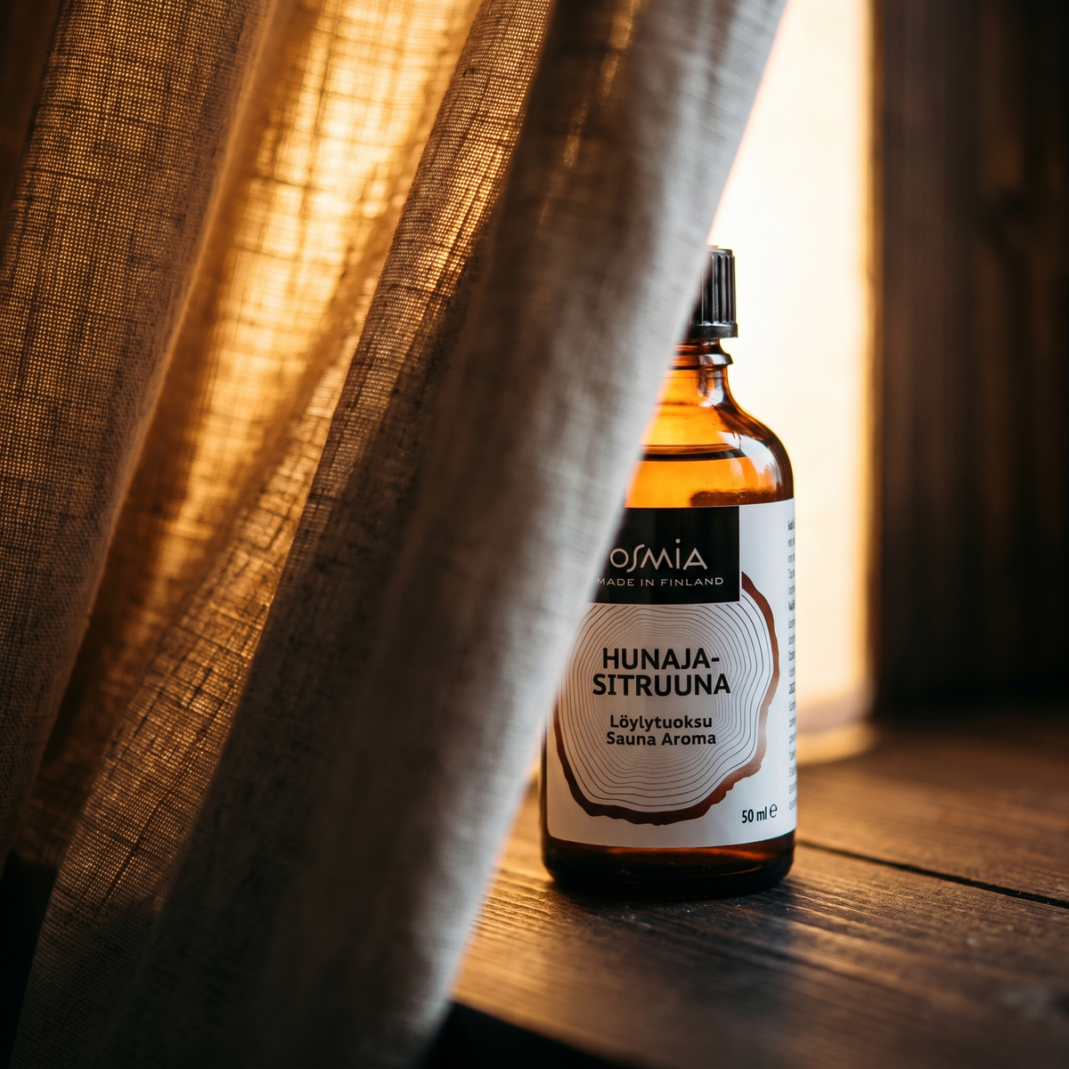 Honey Lemon Sauna Aroma by Osmia (50ml) - lifestyle behind linen curtain