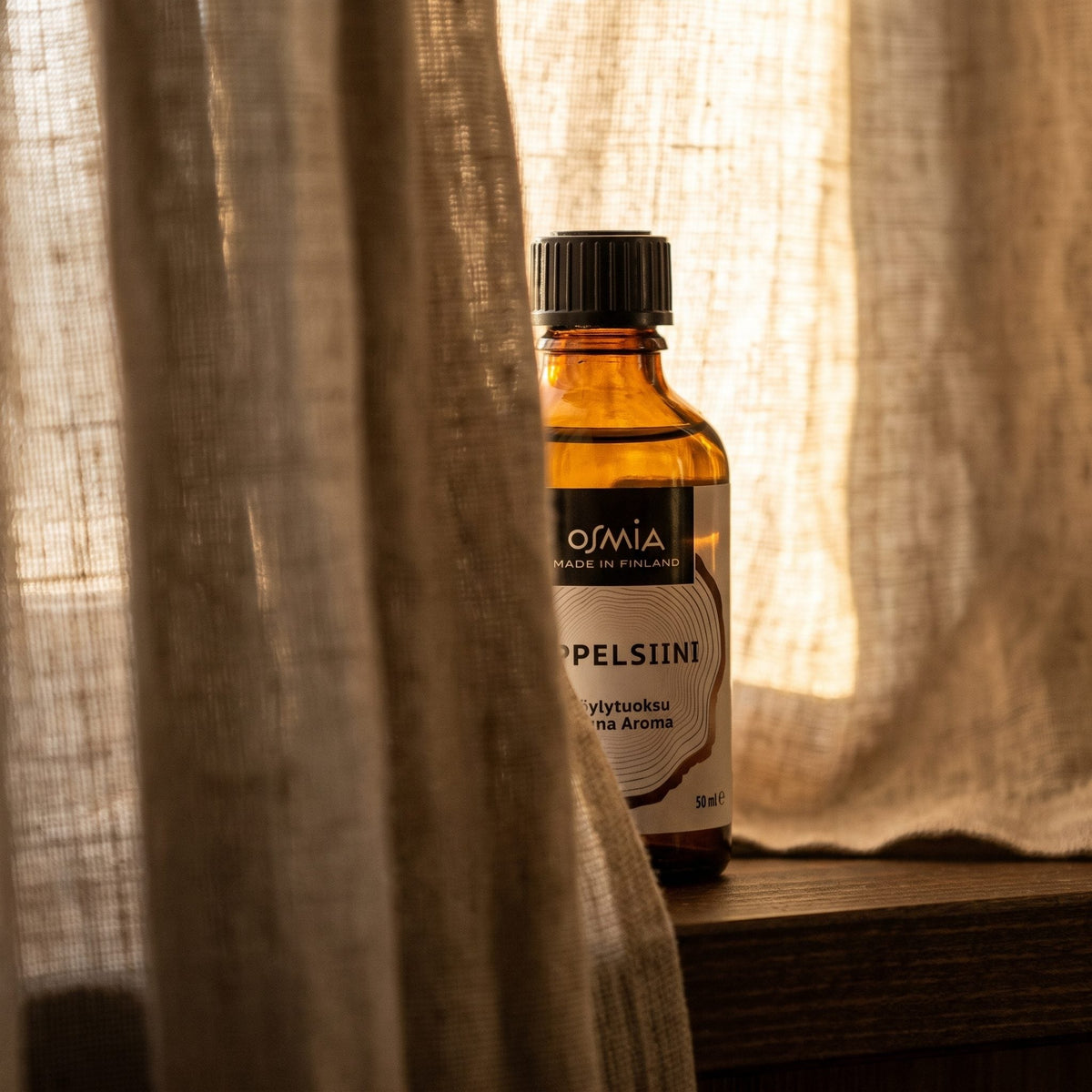 Orange Sauna Aroma by Osmia (50ml) - lifestyle behind linen curtain