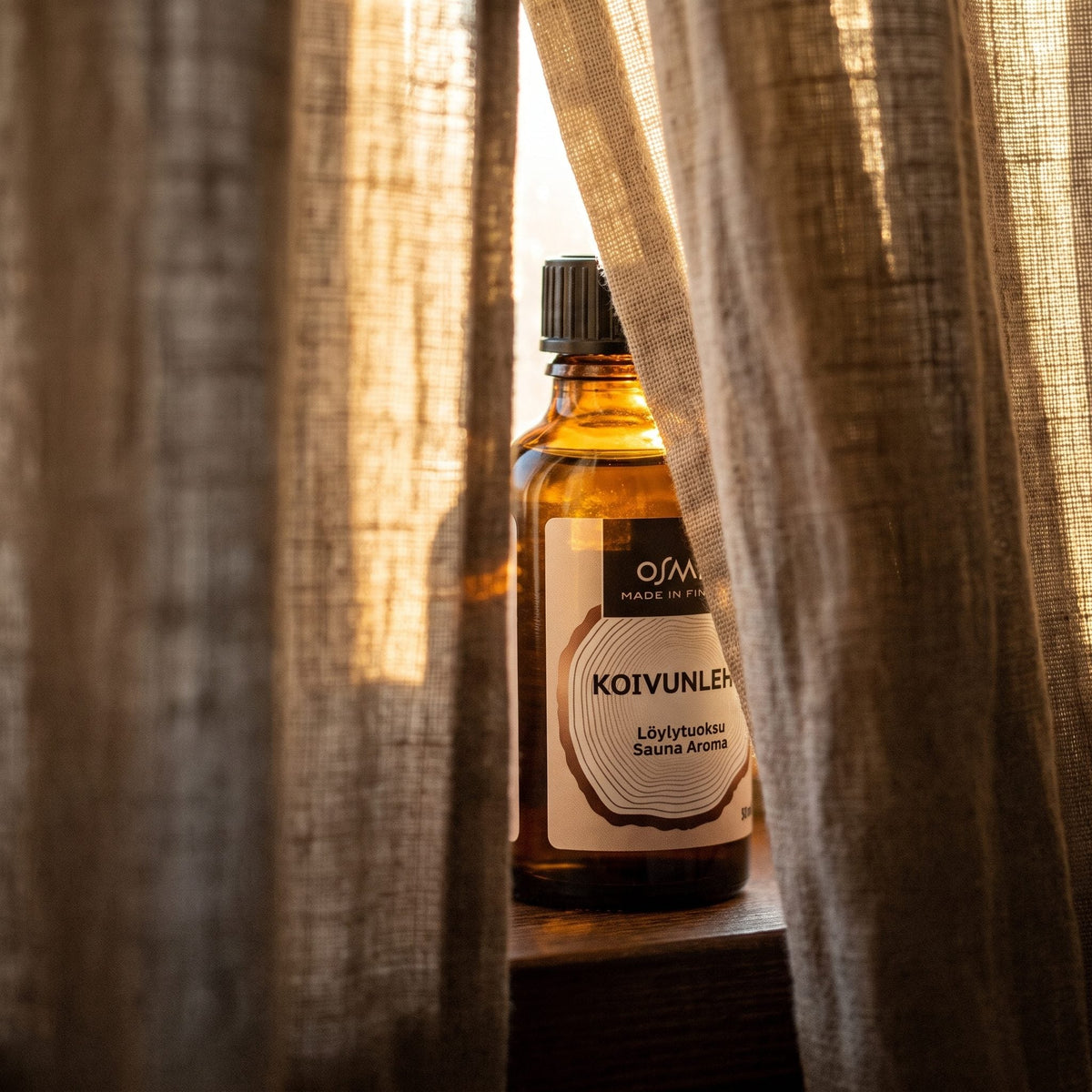 Birch Leaf Sauna Aroma by Osmia (50ml) - lifestyle behind linen curtain