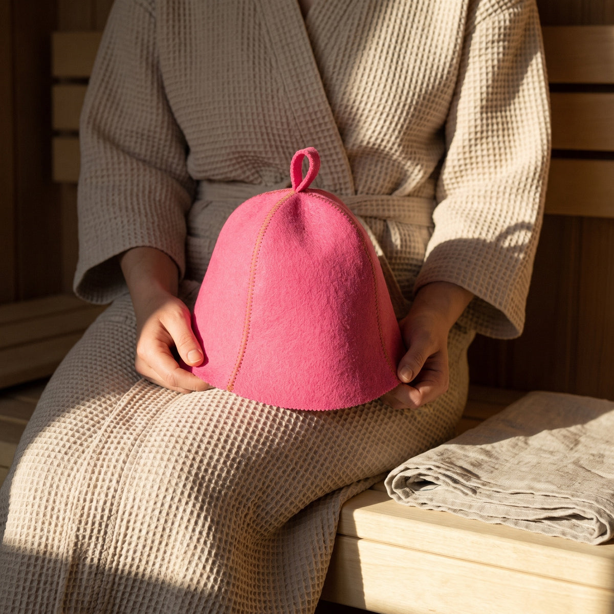 Traditional Lightweight Pink Felt Sauna Hat - held in hands
