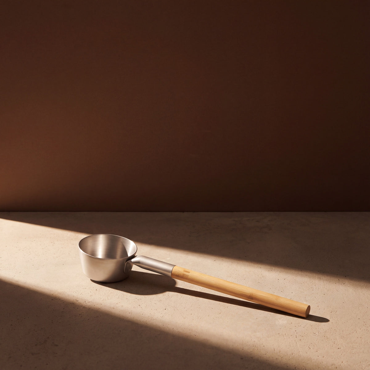 Rento Natural Anodised Aluminium Sauna Ladle - lifestyle in sunlight