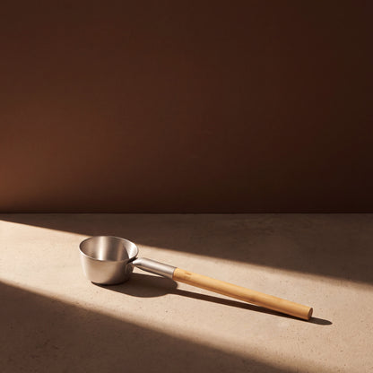 Rento Natural Anodised Aluminium Sauna Ladle - lifestyle in sunlight