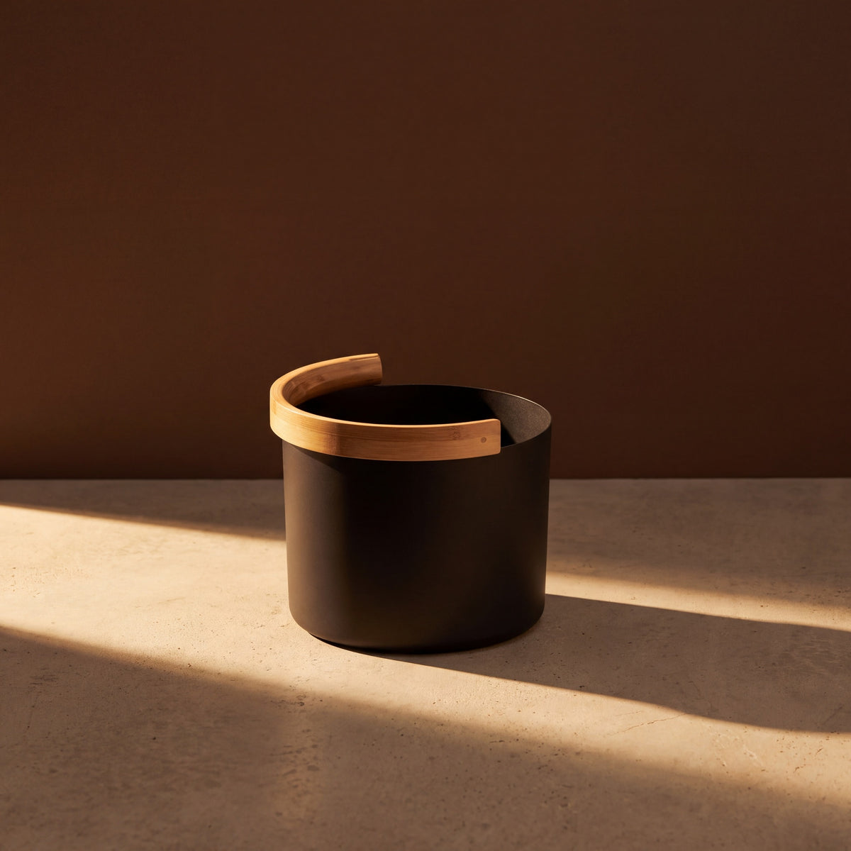 KOLO Rounded Sauna Bucket Black - lifestyle in sunlight