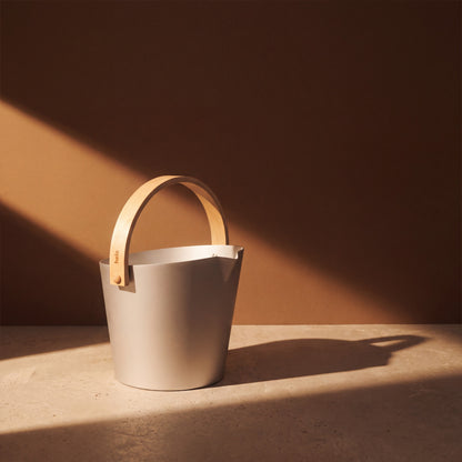 Silver Anodised Aluminium Sauna Bucket (Brilliant Range) by Helo - lifestyle in sunlight